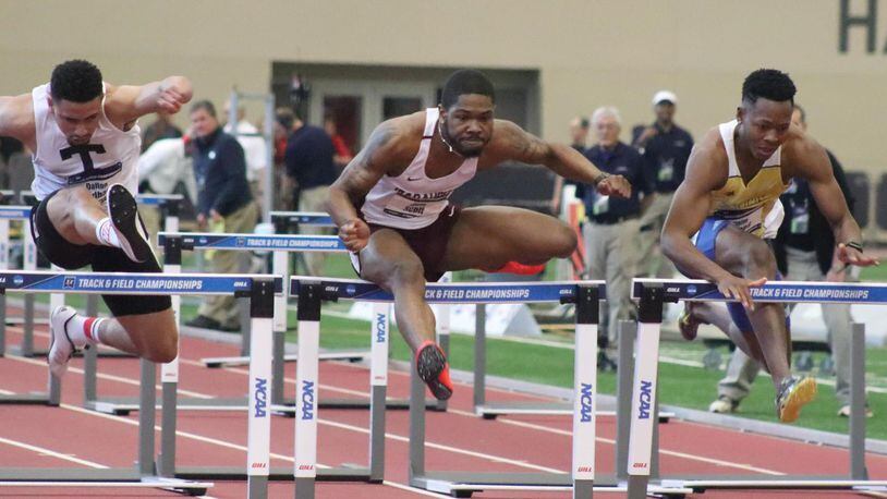 Central State hurdler and Dunbar High School grad Juan Scott (middle) won the NCAA D-II 60-meter indoor hurdles championship. CONTRIBUTED PHOTO