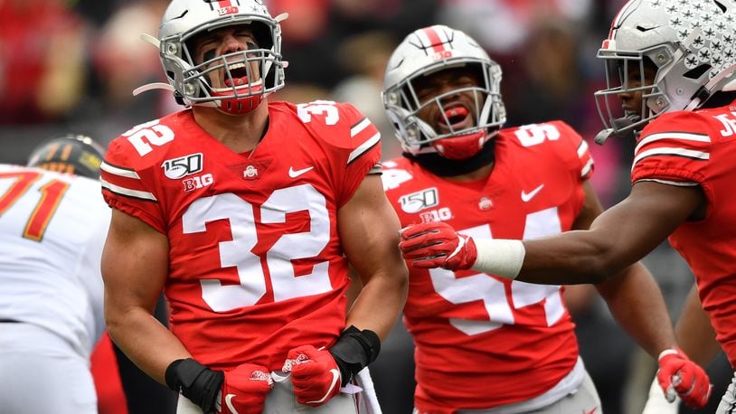 COLUMBUS, OH - NOVEMBER 9: Tuf Borland #32 celebrates a first quarter sack with Tyler Friday #54 of the Ohio State Buckeyes against the Maryland Terrapins at Ohio Stadium on November 9, 2019 in Columbus, Ohio. (Photo by Jamie Sabau/Getty Images)