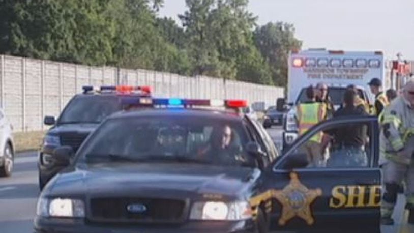 A woman was killed after a tire came off a vehicle and crashed through the windshield of a her car traveling in the opposite direction on I-75 on Thursday, July 19, 2018. STAFF