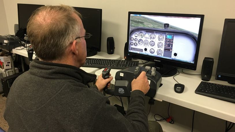 Bill Slagle, a private pilot, is a volunteer flight simulator instructor at the museum and said these simulators aren t just a fun activity for kids. JAMES RIDER