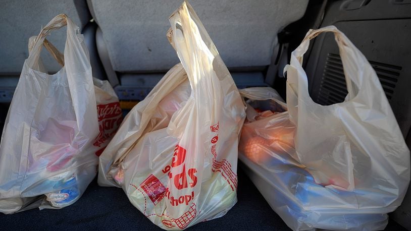 Ohio lawmakers, grocers and business groups are looking to block local governments from regulating the use of plastic grocery bags and other carryout containers.