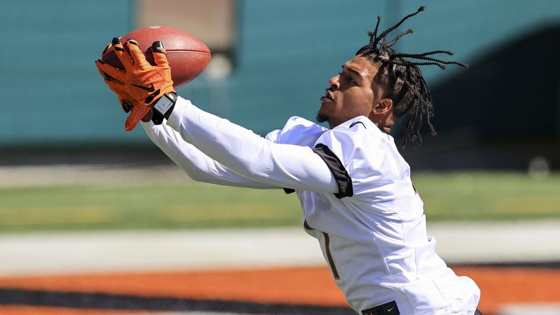 Cincinnati Bengals wide receiver Ja'Marr Chase makes a catch during an NFL football rookie minicamp in Cincinnati, Friday, May 14, 2021. (AP Photo/Aaron Doster)