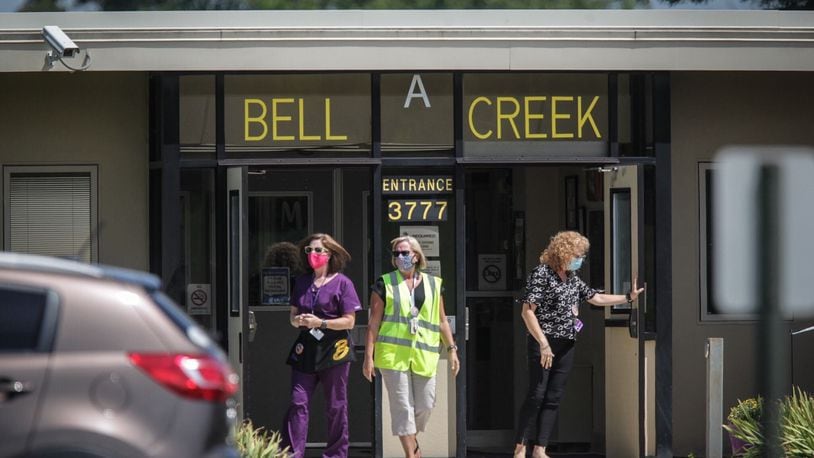 Staff at Bell Creek Intermediate School in Bellbrook prepare for end-of-day dismissal after the first day of classes on Monday, Aug. 17, 2020.