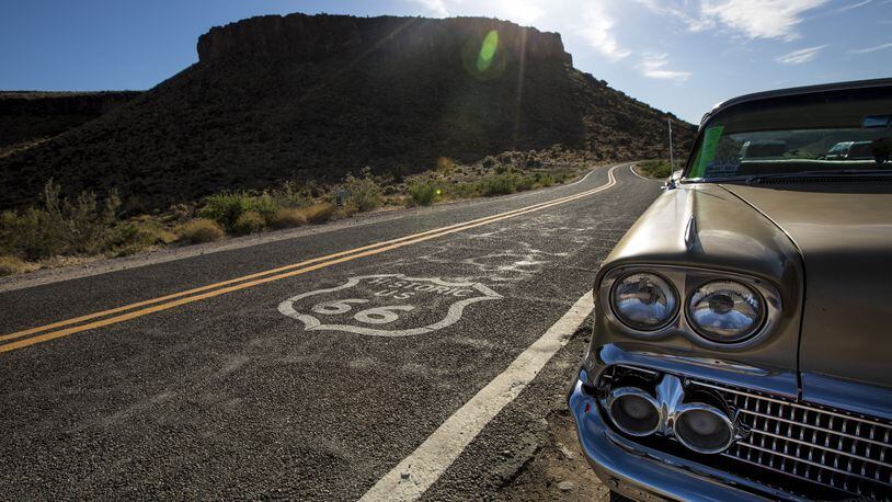 The Black Mountains provide a backdrop for a vintage Chevrolet is parked in front of the1920s Cool Springs Service Station, now a souvenir shop on Historic Route 66 in Cool Springs, Ariz., on May 7, 2017. (Brian van der Brug/Los Angeles Times/TNS)