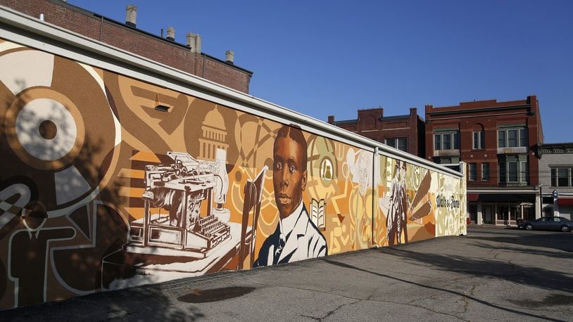 In Dayton’s Wright-Dunbar neighborhood the Dayton Region’s Walk of Fame mural, in the 1100 block of W. Third Street, commemorates poet Paul Laurence Dunbar and aviation pioneers Orville and Wilbur Wright. LISA POWELL / STAFF