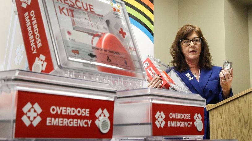 Barbara Marsh, Assistant to the Health Commissioner, Public Health -- Dayton & Montgomery County, pictured in early 2020, shows new opioid rescue kits containing naloxone. CHRIS STEWART / STAFF