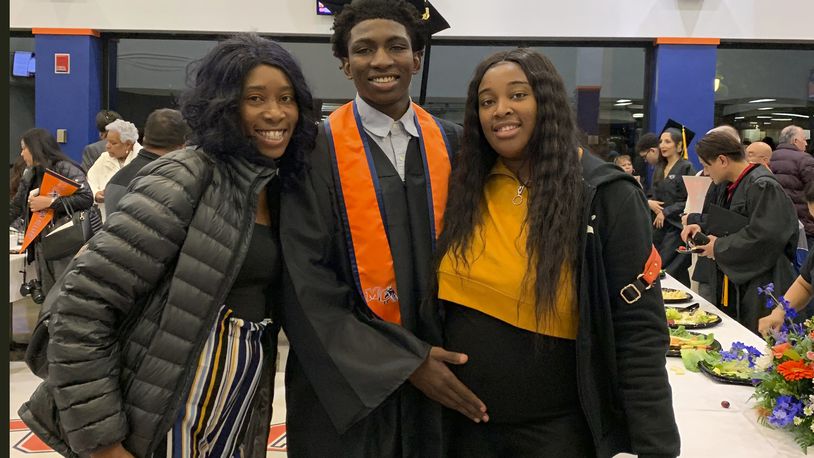 This 2019 photo provided by Porscha Banks, shows Dexter Reed, center, along with his mother Nicole Banks and sister Porscha Banks. Reed died March 21, 2024 after Chicago Police officers shot him during a traffic stop. Plainclothes Chicago police officers fired nearly 100 gun shots over 41 seconds during a traffic stop that left Dexter Reed dead and one officer injured, according to graphic video footage a police oversight agency released Tuesday, April 9. (Porscha Banks via AP).