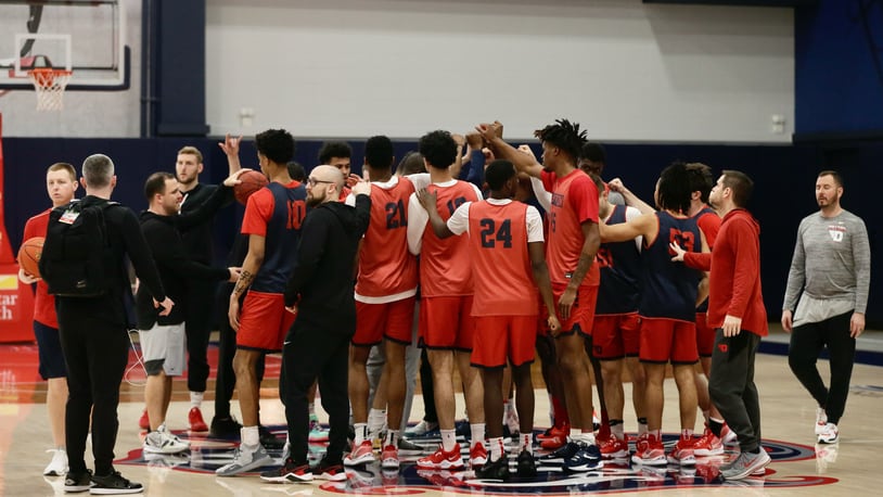 Dayton huddles before practice at the Entertainment and Sports Arena in Washington, D.C., on Thursday, March 10, 2022, one day before playing in the quarterfinals of the Atlantic 10 Conference tournament. David Jablonski/Staff
