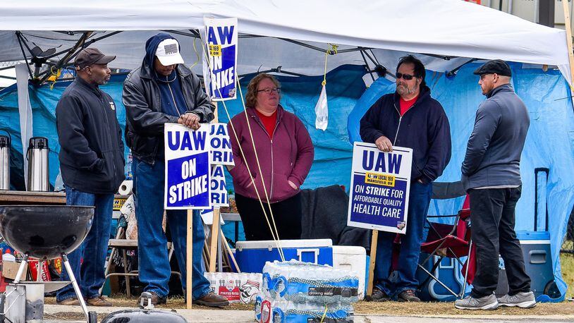 United Auto Workers union members from GM Service Parts Operations plant on Jacquemin Drive in West Chester Township continue to strike Wednesday, Oct. 16. UAW and GM have reaches a tentative agreement that could bring the strike to an end. NICK GRAHAM/STAFF