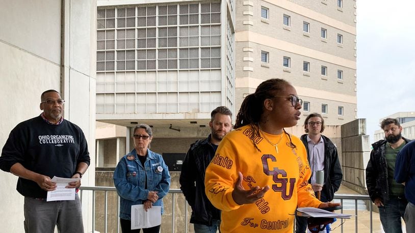 Daj’za Demmings, a member of the Montgomery County Jail Coalition, speaks at a news conference Wednesday outside the jail. CHRIS STEWART / STAFF