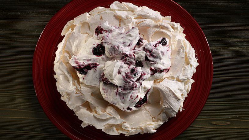 Whipped cream, roiled dark with blueberry mash, makes for a dramatic dessert, one worthy of its stunning namesake, asperitas clouds. (Abel Uribe/Chicago Tribune/TNS)