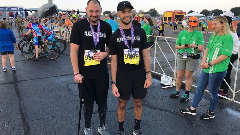 Retired Marine corporal Matthew Bradford (left) and guide Anthony Allen on Saturday at the U.S. Air Force Marathon. Tom Archdeacon/CONTRIBUTED