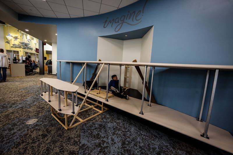 A Wright Brothers plane replica is a part of the new Burkhardt Branch Library that opened on Monday April 25, 2022. JIM NOELKER/STAFF