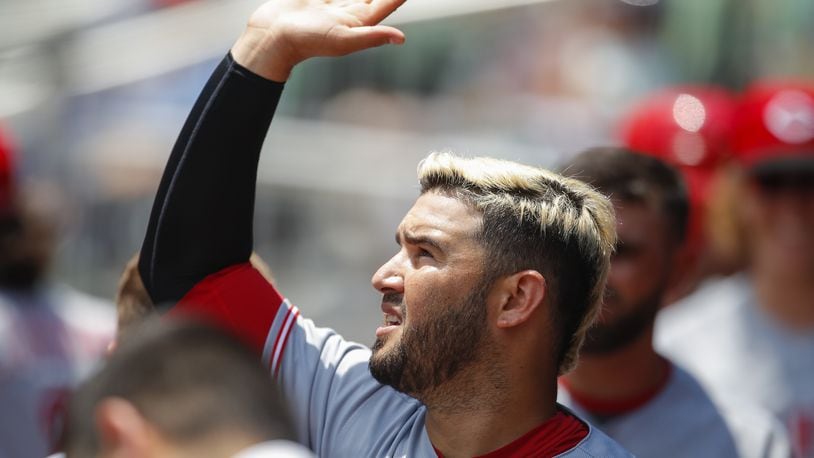 ATLANTA, GA - JUNE 27: Eugenio Suarez #7 of the Cincinnati Reds celebrates with teammates after scoring in the seventh inning of an MLB game against the Atlanta Braves at SunTrust Park on June 27, 2018 in Atlanta, Georgia. (Photo by Todd Kirkland/Getty Images)