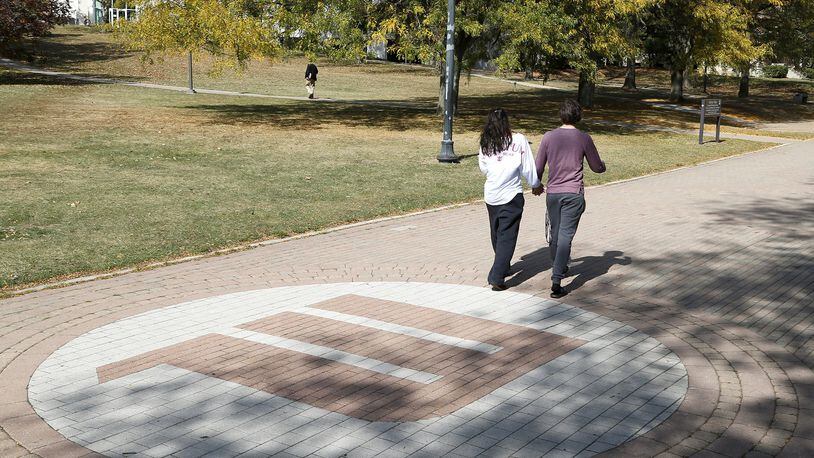 Students walk across campus at Wittenberg University. Bill Lackey/Staff