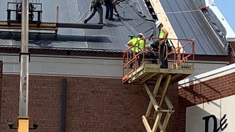 Roofers at Brookville High School switched their hours to escape the excessive heat. CONTRIBUTED