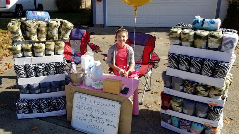 A 5th grade Springboro resident held a hot chocolate stand this month to raise money for Warm Hugs, a nonprofit program which distributes blankets to Hispanic children/families in need.