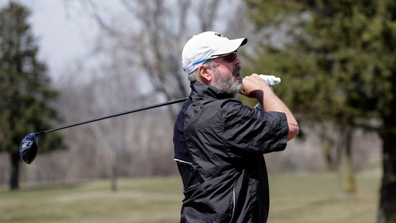 HOLD FOR STORY BY ERIC OLSON- In this April 5, 2018 photo, Bellevue University golf team member Don Byers follows the ball he hit during practice at the Platteview Golf Club in Bellevue, Neb. 61-year-old Byers is the oldest athlete in the NAIA since Alan Moore kicked an extra point for Faulkner University of Alabama when he was 61 in 2011. (AP Photo/Nati Harnik)