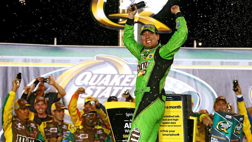 SPARTA, KY - JULY 11: Kyle Busch, driver of the #18 M&M’s Crispy Toyota, celebrates in Victory Lane after winning the NASCAR Sprint Cup Series Quaker State 400 presented by Advance Auto Parts at Kentucky Speedway on July 11, 2015 in Sparta, Kentucky. (Photo by Sarah Crabill/Getty Images)