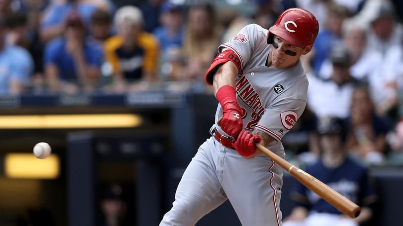MILWAUKEE, WISCONSIN - JUNE 22:  Derek Dietrich #22 of the Cincinnati Reds hits a triple in the first inning against the Milwaukee Brewers at Miller Park on June 22, 2019 in Milwaukee, Wisconsin. (Photo by Dylan Buell/Getty Images)