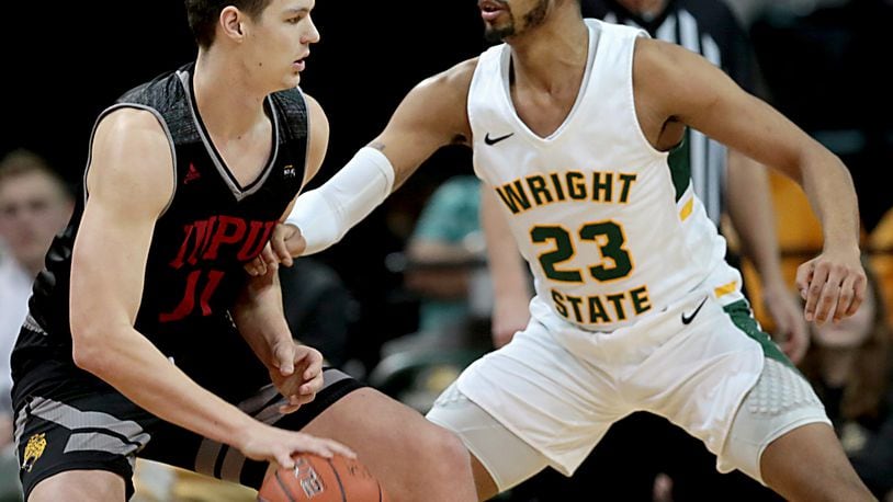 Wright State University forward James Manns covers IUPUI forward/center Brandon Kenyon during their Horizon League game at the Nutter Center in Fairborn Sunday, Feb. 16, 2020. Wright State won 106-66. Contributed photo by E.L. Hubbard