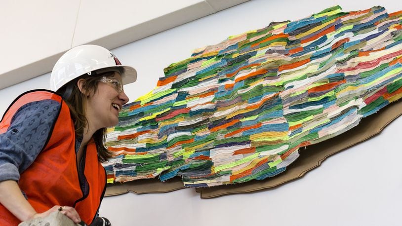 Artist Andrea Myers installs her work. CONTRIBUTED PHOTO BY ANDY SNOW