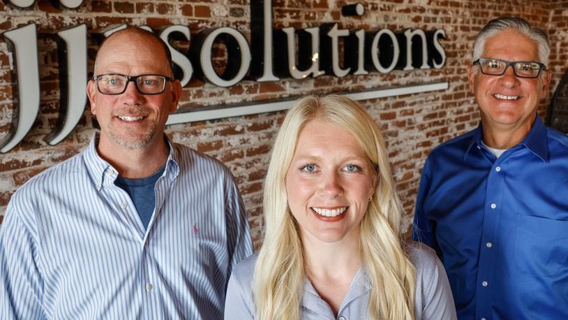 From left, Dave Judson, C.E.O., Carly Cox President & C.O.O. and Dan Marion C.M.O. of JJR Solutions are based in Dayton with offices in Washington D.C. and Colorado Springs. JIM NOELKER/STAFF