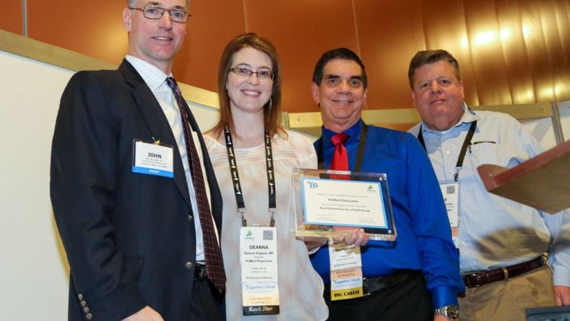 From left, Dr. John Kennedy, president, of American Medical Group Association Foundation, presents an award to PriMed representatives Dr. Deanna Allgeyer, Dr. Mark Couch, and Bob Matthews, president and CEO of MediSync, a partner organization of PriMed. CONTRIBUTED