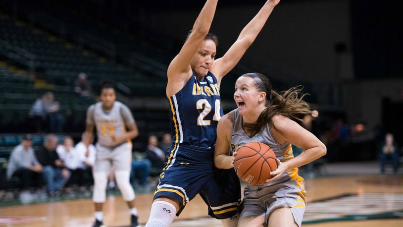 Wright State’s Mackenzie Taylor looks to drive past Kent State’s Alexa Golden during a game earlier this season. Taylor recently surpassed the 1,000-point mark for her career. Joseph Craven/CONTRIBUTED