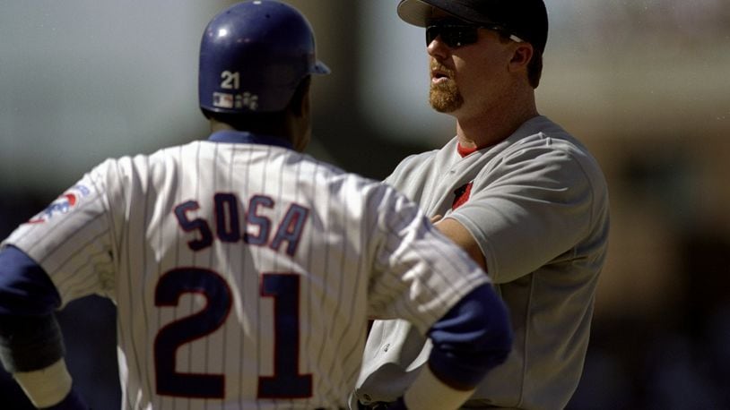 19 Aug 1998: First-baseman Mark McGwire #25 of the St.Louis Cardinals stands and talks to Sammy Sosa #21 of the Chicago Cubs at Wrigley Field in Chicago,Illinois. The Cardinals defeated the Cubs 8-6.