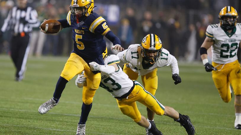 Springfield's Aaron Scott runs for a first down against Lakewood St. Edward during the Division I state championship game in Canton on Friday, Dec. 1, 2023. BILL LACKEY/STAFF