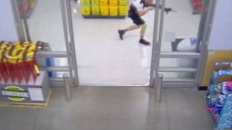 Beavercreek police officer Sean Williams moves through Walmart during the Aug. 5, 2014 incident in which Williams shot and killed John Crawford III.