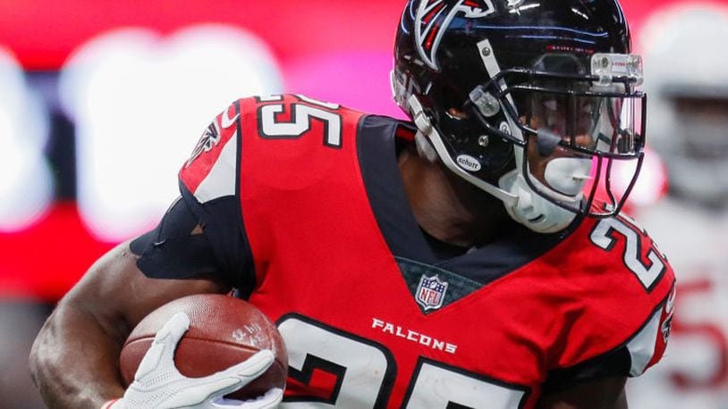 ATLANTA, GA - AUGUST 26: Atlanta Falcons running back Brian Hill (25) rushes during an NFL football game between the Arizona Cardinals and the Atlanta Falcons on August 26, 2017 at Mercedes-Benz Stadium in Atlanta, GA. The Arizona Cardinals won the game 24-14. (Photo by Todd Kirkland/Icon Sportswire)
