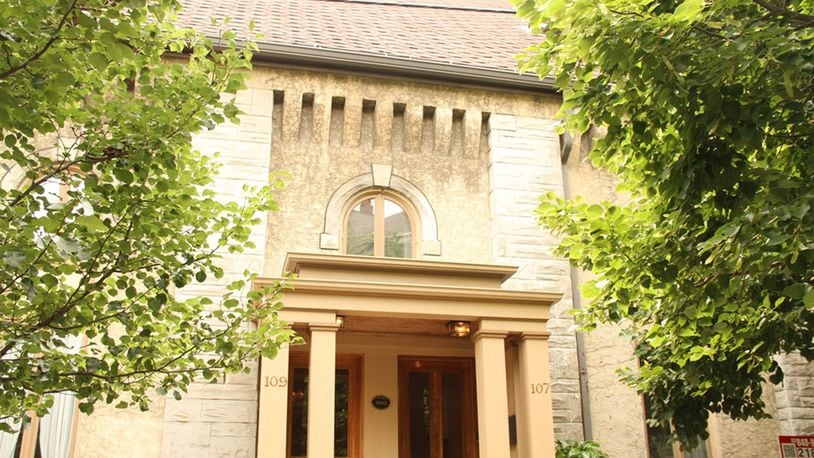 Located in Dayton’s historical Oregon District, this elegant home is one of 4 condominiums designed within a 19th century church. A 5-foot wall provides privacy on the courtyard patio, which is enclosed with an iron gate. CONTRIBUTED PHOTOS BY KATHY TYLER