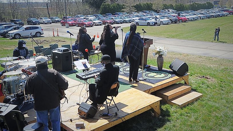 St. Luke Missionary Baptist Church hosted a drive-in multi-racial, multi-denominational outdoor worship service on Good Friday to help bring the Miami Valley community together in worship and song while marking the death of Jesus on the cross. MARSHALL GORBY\STAFF