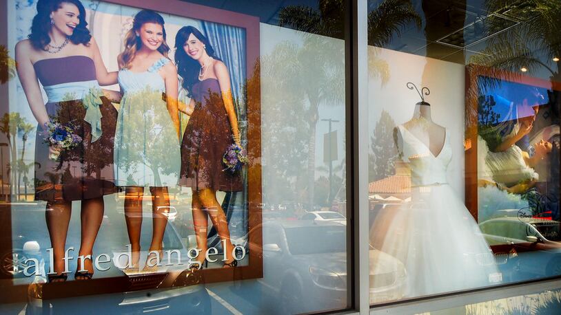 A window display is seen at Alfredo Angelo bridal store in West Covina, Calif., Friday, July 14, 2017. The wedding dress retailer declared bankruptcy late Thursday, July 13, and suddenly shut down all of its stores, leaving customers without answers about how they'll get their dresses that are already on order. (Walt Mancini /Los Angeles Daily News via AP)