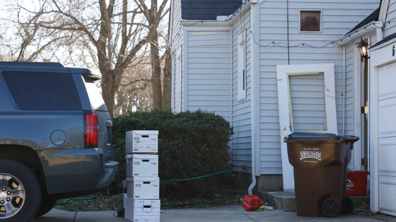 The FBI was conducting an investigation at a home in the 600 block of West Alex Bell in Washington Twp. Monday, Nov. 21, 2022. A broken door was outside the home as well as boxes carried outside by investigators. JIM NOELKER / STAFF