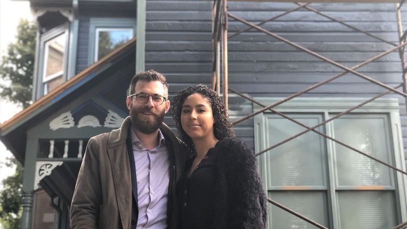 Marshall Weil and Gisselle Pereira purchased a home in Wright Dunbar Village earlier this year. The couple strongly encouraged their good friends Michael and Heather Allen to house hunt in the neighborhood. The Allens and Weil and Pereira now live one block apart. CORNELIUS FROLIK / STAFF