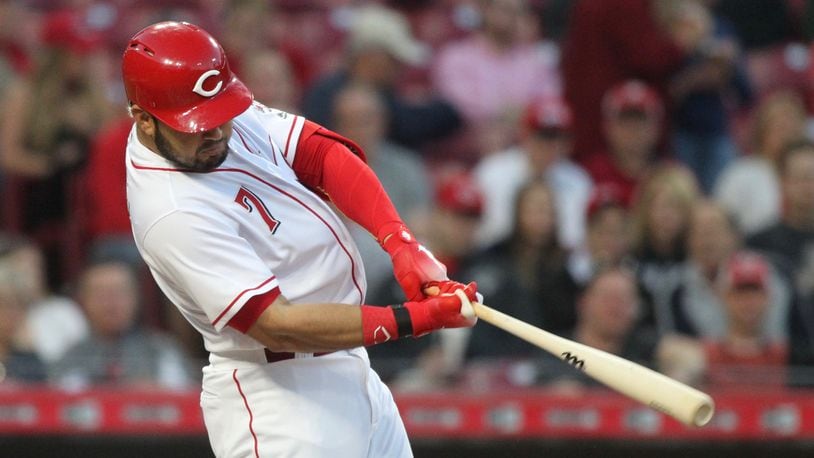 The Reds’ Eugenio Suarez doubles and drives in two runs against the Brewers on Monday, April 30, 2018, at Great American Ball Park in Cincinnati. David Jablonski/Staff