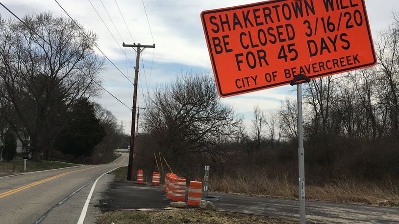 Signs posted notifying drivers of the 45-day closing of Shakertown Rd. at US 35 in Beavercreek beginning Monday. Staff photo / Sarah Franks