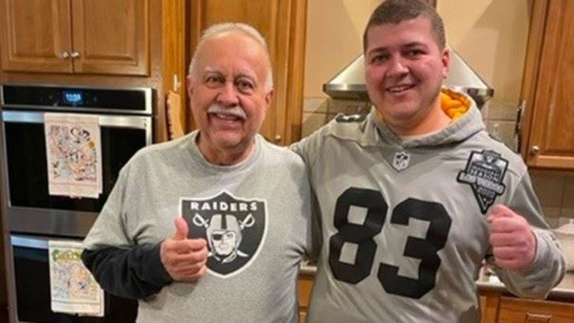 Ed Fernandes and his grandson, Noah Harsh, show their allegiance to the Las Vegas Raiders prior to the Jan. 15, 2022 NFL playoff game versus the Cincinnati Bengals. Fernandes, 78, went into cardiac arrest before entering Paul Brown Stadium and was revived by Jerry Mills, a die-hard Bengals fan and an emergency room nurse. CONTRIBUTED