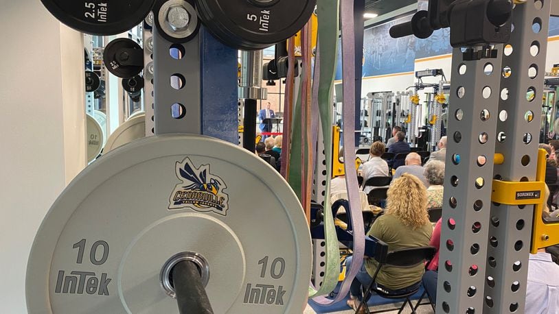 Dr. Thomas White speaks at the Callan Athletic and Academic Expansion dedication in the new weight room within the facility at Cedarville University. CONTRIBUTED