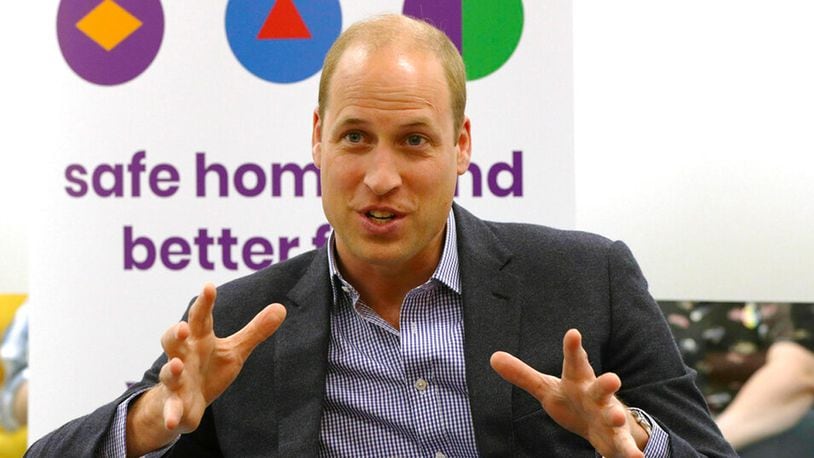 Prince William speaks to former and current service users during a visit to the Albert Kennedy Trust to learn about the issue of LGBTQ youth homelessness and the approach the organization is taking to tackle the problem. (Jonathan Brady/Pool via AP)