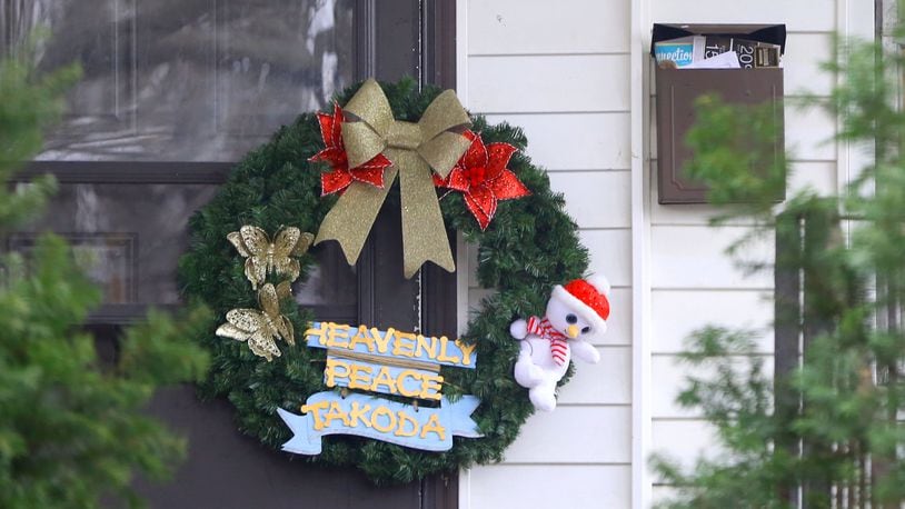 A wreath has been left on the front door of 1934 Kensington Drive in Dayton. Takoda Collins, 10, was rushed to Dayton’s Children’s Hospital on Dec. 13 and was pronounced dead after his father Al-Mutahan McLean called police to say he found the boy unresponsive in their Kensington Drive home. McLean, 30, faces charges in Montgomery County Common Pleas Court in connection to what law enforcement described in court records as “extreme” child abuse against Takoda. LISA POWELL / STAFF