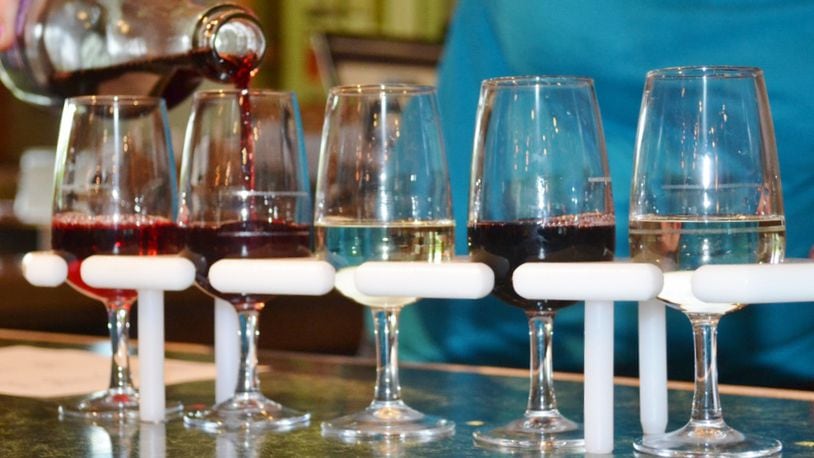 Wine samples being poured in the tasting room of The Winery at Versailles. File photo by MARK FISHER