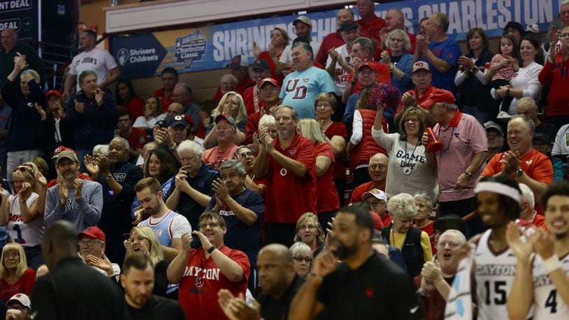 Dayton fans cheer during a game against St. John’s in the semifinals of the Charleston Classic on Friday, Nov. 17, 2023, at TD Arena in Charleston, S.C. David Jablonski/Staff