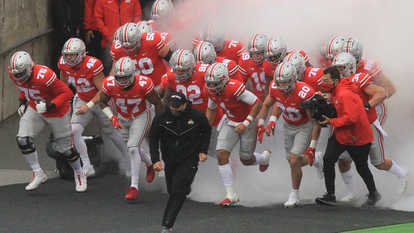 Ohio State coach Ryan Day leads the team onto the field before a game against Indiana on Saturday, Nov. 22, 2020, at Ohio Stadium in Columbus. David Jablonski/Staff