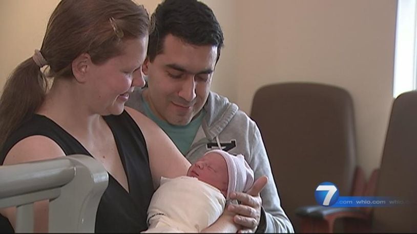 Juliana and Carlos Macedo, and their newborn son, Daniel, who was born on the side of Interstate 75 in Dayton.