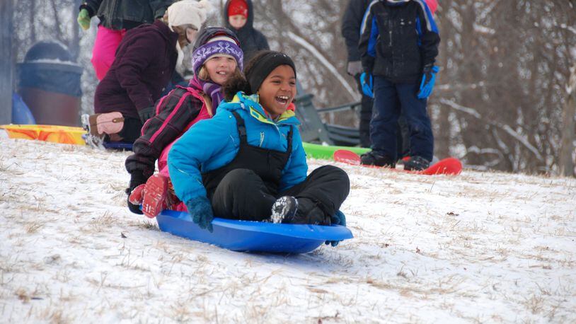 Proper winter wear can make an afternoon of sledding more fun. These young sledders enjoy Taylorsville MetroPark. AMY FORSTHOEFEL/CONTRIBUTED