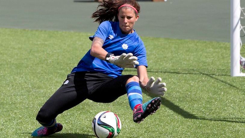 Team Canada's goalkeeper goalkeeper Stephanie Labbe makes a save during a practice session in Edmonton, Alberta, on Friday June 5, 2015. Canada takes on China in their first Women's World Cup match on Saturday June 6, 2015. (Jason Franson/The Canadian Press via AP) MANDATORY CREDIT